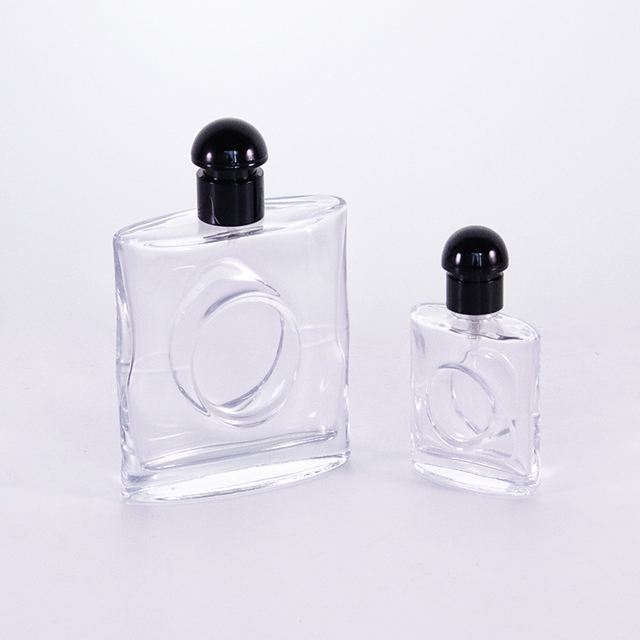 Flacon de parfum plat avec cercle sur le couvercle central en plastique noir