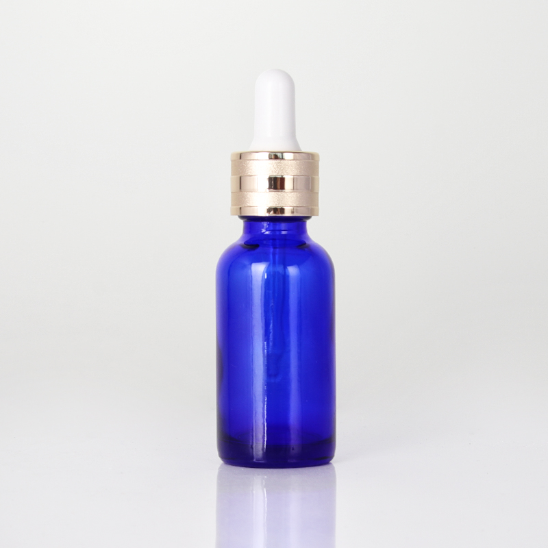 Bouteille d'huile essentielle en verre bleu de 30 ml pour un usage quotidien